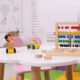 Different toys on table in playroom. Kindergarten interior